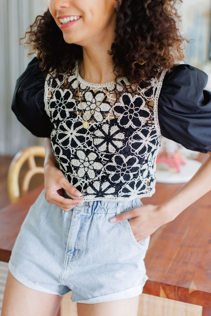 Black puff sleeve crop top with tan embroidered floral overlay 