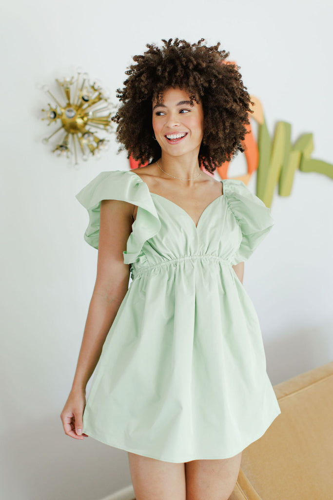 Light green sweetheart neckline ruffle sleeve mini dress with tie back