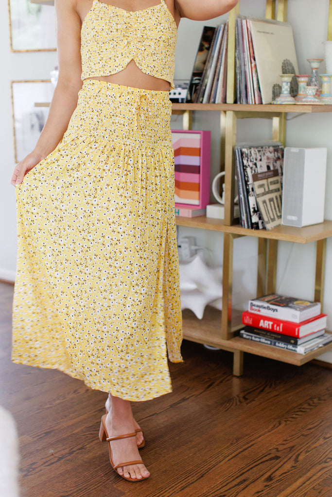 Yellow midi skirt with white floral design and leg slit 