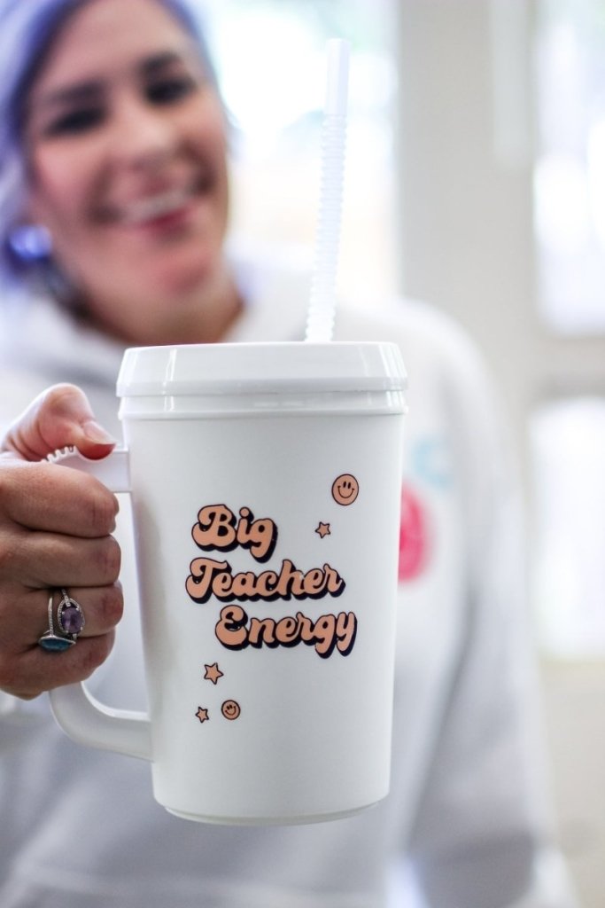 22 oz mega mug with lid and straw with the phrase "Big Teacher Energy"
