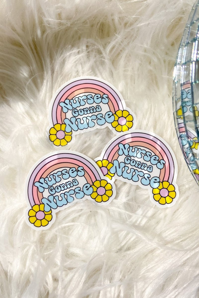 Pastel toned sticker with a rainbow and "nurses gonna nurse" 