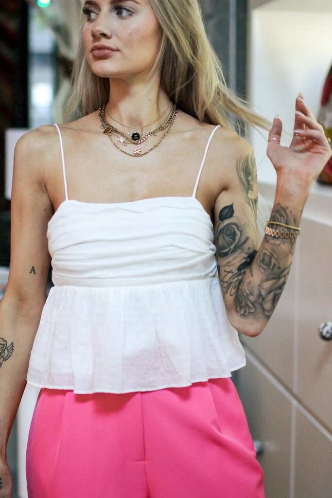 The Sienna Babydoll Tank in White - Girl Tribe Co.